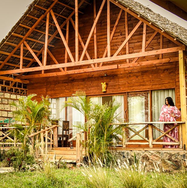 A luxurious villa in Moshi, Tanzania, with stunning views of the surrounding mountains. The villa is surrounded by a lush garden, and it is home to a variety of wildlife, including servals. The villa is perfect for guests who want to experience the beauty of Tanzania's wildlife in a luxurious setting.